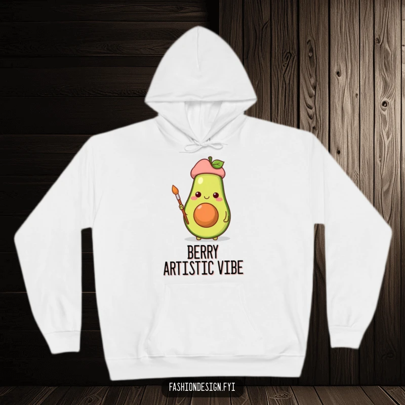 Funny hoodie with a cheerful avocado artist wearing a beret, paintbrush in hand, radiating artistic joy.